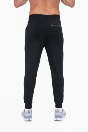 Men’s black and olive sleek knit performance joggers with rear zip pocket, inseam pockets, and cuffed hem.